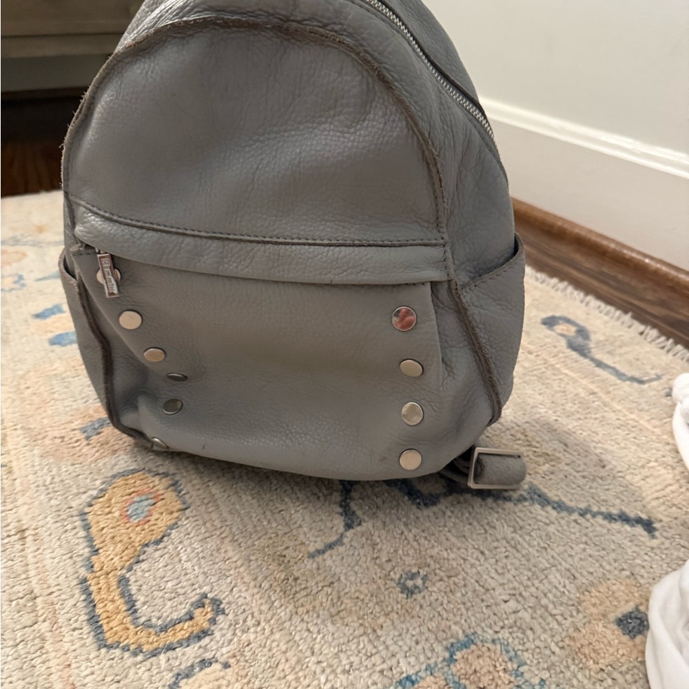 Gray Leather Backpack with Silver Accents